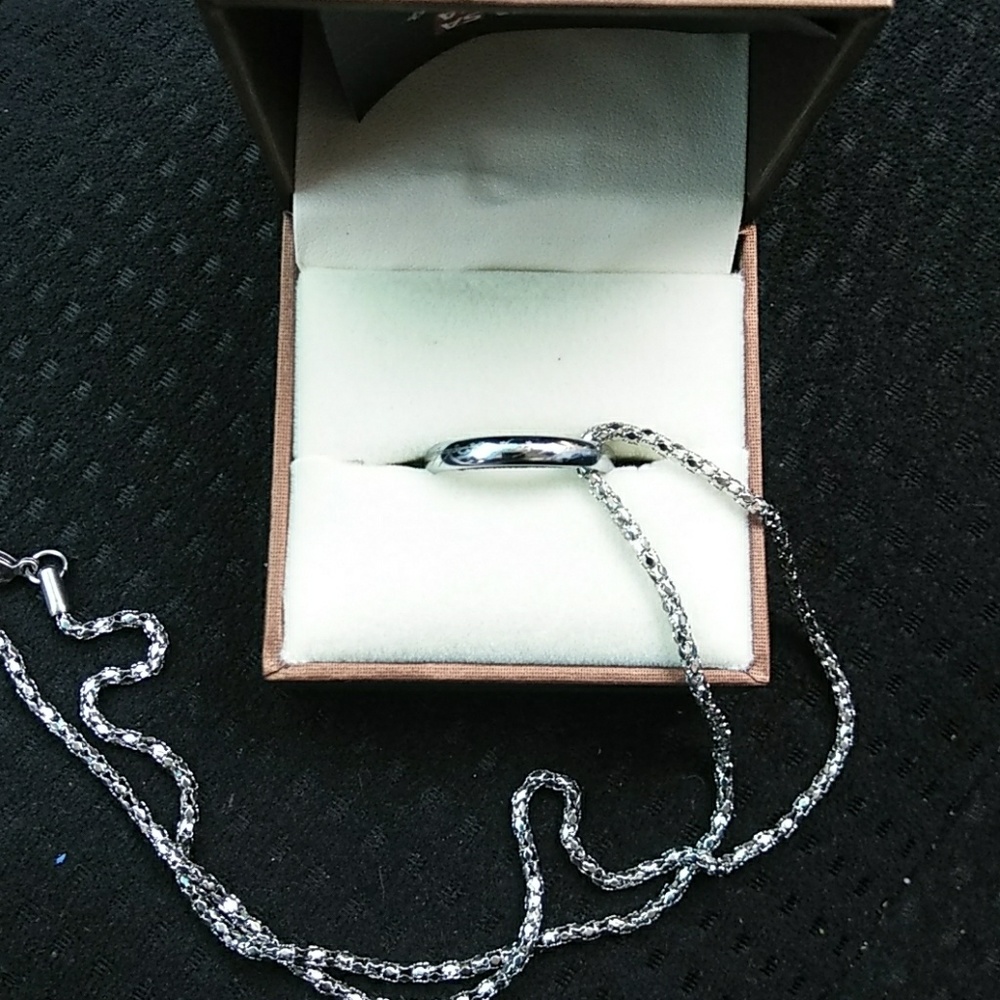 Lord of The Ring with elvish writing. Silver tone.